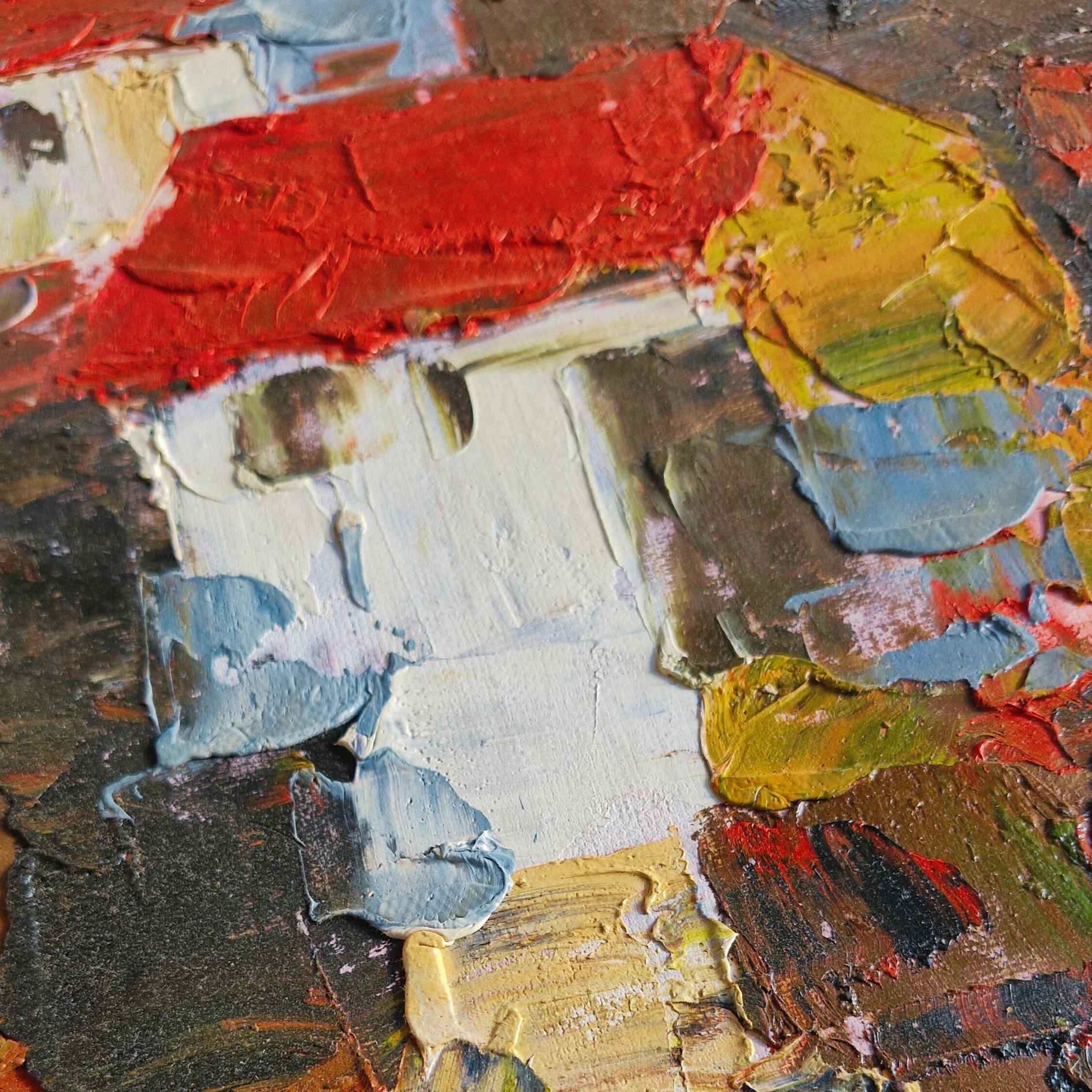 Detalle de textura de lienzo decorativo con paisaje urbano abstracto y colores vibrantes en técnica de óleo