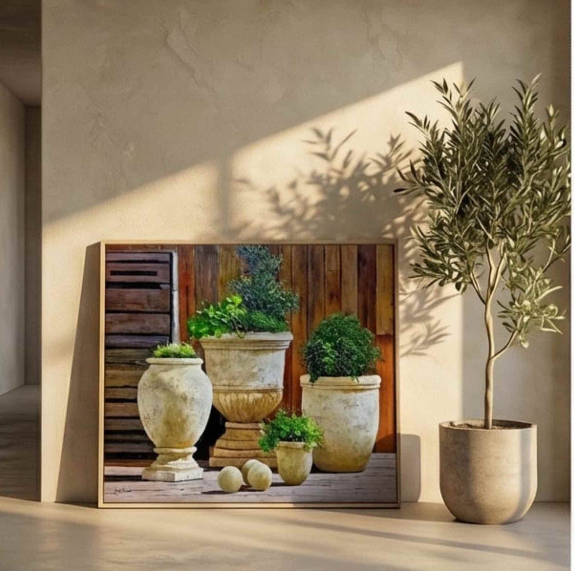 Cuadro decorativo de macetas de piedra con plantas verdes
